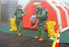 People in a hazmat suit getting ready