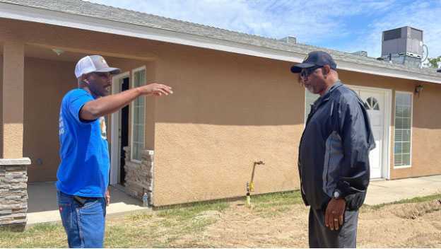 Bethel Church of Christ Holiness USA Pastor Darrell Jones speaks to PARCS Liaison and OCA partner serving BIPOC communities, Pastor BT Lewis about permitting issues faced by the church in their on-site community center construction project.