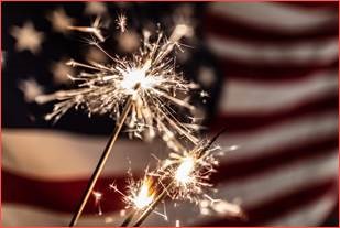 firecracker fireworks in front of United States flag